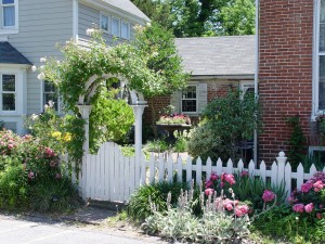 The fence, walls and arbor turn this space into an outdoor room.