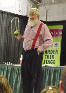 Roger Swain wielding a lawn sprinkler at the 2011 Pa. Garden Expo.