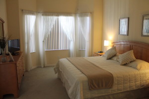 The master bedroom features its own TV and bathroom.
